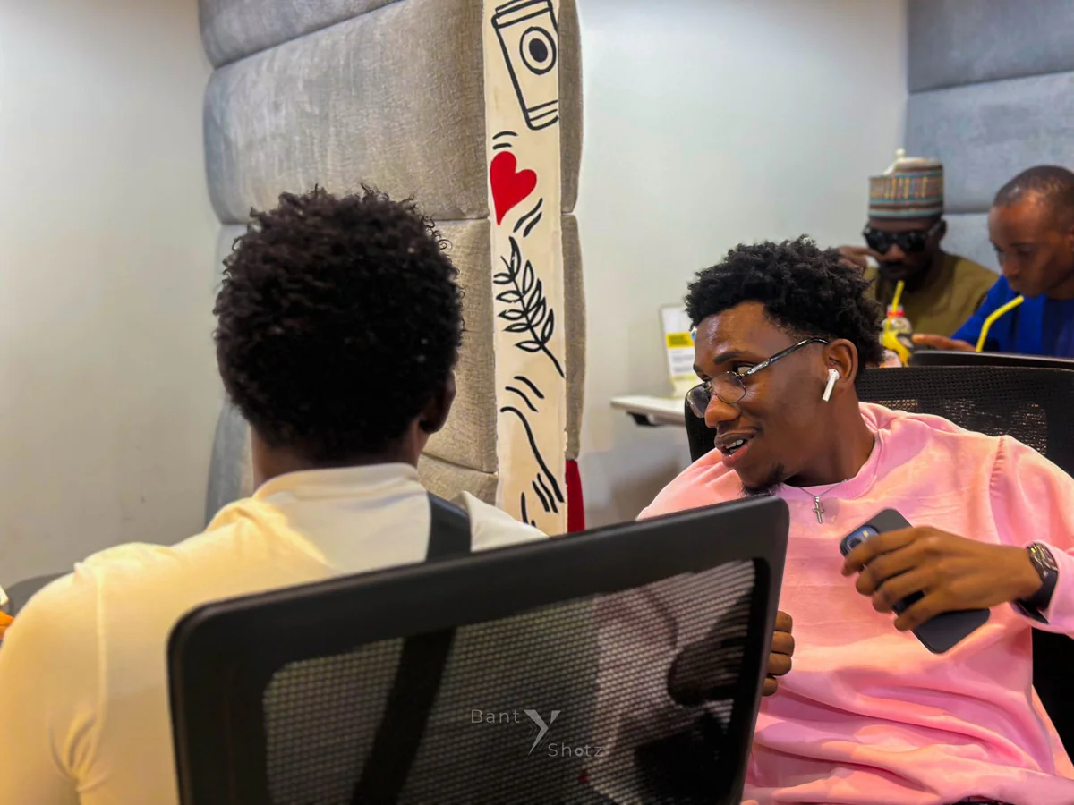 Korede Adeyemi in conversation at a co-working space
